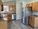 Well-equipped kitchen with stainless steel appliances, wood cabinets, and laminate counters at 1959 Crystal Bay East Dr, Plainfield, IN 46168