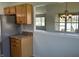 Open kitchen view with stainless steel refrigerator and a view to the lake at 1959 Crystal Bay East Dr, Plainfield, IN 46168