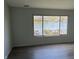 Cozy living room with a lake view and hardwood flooring throughout at 1959 Crystal Bay East Dr, Plainfield, IN 46168