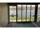 Screened-in patio offering views of the lake and surrounding community at 1959 Crystal Bay East Dr, Plainfield, IN 46168