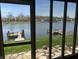 Enclosed patio showcasing waterfront scenery and direct lake access at 1959 Crystal Bay East Dr, Plainfield, IN 46168