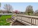 A cozy backyard deck enhances outdoor enjoyment, with a manicured lawn and garden beds at 2075 Sea Hero Ct, Indianapolis, IN 46234