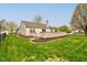 Home's fenced backyard features an expansive wooden deck for outdoor enjoyment at 2075 Sea Hero Ct, Indianapolis, IN 46234