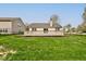A large deck in a fully fenced backyard with well maintained lawn at 2075 Sea Hero Ct, Indianapolis, IN 46234