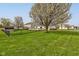 Fenced backyard with a deck and mature tree at 2075 Sea Hero Ct, Indianapolis, IN 46234