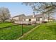 Backyard featuring a fenced yard, deck, and manicured landscaping at 2075 Sea Hero Ct, Indianapolis, IN 46234