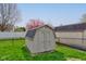 Backyard shed offers practical storage solutions, set within a fenced yard with mature trees at 2075 Sea Hero Ct, Indianapolis, IN 46234