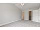 A bright bedroom with plush carpeting and a vaulted ceiling has closet space at 2075 Sea Hero Ct, Indianapolis, IN 46234