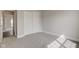 A bedroom has neutral carpet and paint with a closet with sliding doors and an open doorway at 2075 Sea Hero Ct, Indianapolis, IN 46234