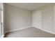 A bedroom features neutral carpet, a closet with sliding doors, and neutral paint at 2075 Sea Hero Ct, Indianapolis, IN 46234