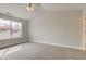 A bright bedroom features plush carpeting, a window, and vaulted ceiling at 2075 Sea Hero Ct, Indianapolis, IN 46234