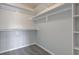 The closet has built-in shelving and rod, with carpeted floors at 2075 Sea Hero Ct, Indianapolis, IN 46234