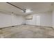 Attached garage with painted walls, storage cabinets, and overhead door at 2075 Sea Hero Ct, Indianapolis, IN 46234