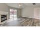 This bright living area features a fireplace and a sliding door to a deck at 2075 Sea Hero Ct, Indianapolis, IN 46234