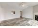A spacious living room boasts a fireplace, a ceiling fan, and open layout at 2075 Sea Hero Ct, Indianapolis, IN 46234
