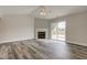 An airy living room with a fireplace and sliding door that opens onto a deck at 2075 Sea Hero Ct, Indianapolis, IN 46234
