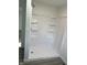 Bathroom featuring a walk-in shower with built-in shelves at 2185 W State Road 234, Fortville, IN 46040