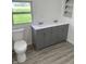 Bathroom features double vanity and wood-look flooring at 2185 W State Road 234, Fortville, IN 46040