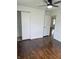 Bedroom with hardwood floors, closet, and ceiling fan at 2185 W State Road 234, Fortville, IN 46040