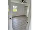 Bedroom with laminate floors, closet, and natural light at 2185 W State Road 234, Fortville, IN 46040