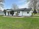 A charming single-story home with lush green grass and a classic design at 2185 W State Road 234, Fortville, IN 46040