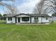 Charming single-story home with white siding and a well-manicured lawn at 2185 W State Road 234, Fortville, IN 46040
