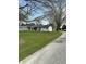 Single story home featuring a well-maintained lawn and mature trees at 2185 W State Road 234, Fortville, IN 46040