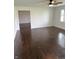 An open living room with hard wood floors and lots of space at 2185 W State Road 234, Fortville, IN 46040