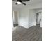 Living room with fresh paint and open doorways at 2185 W State Road 234, Fortville, IN 46040