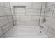 Luxurious bathroom featuring a jacuzzi tub and modern tile, creating a spa-like experience at 226 N Cleveland St # 226C, Indianapolis, IN 46204
