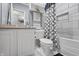 Well-lit bathroom featuring white subway tile in the shower and white vanity at 226 N Cleveland St # 226C, Indianapolis, IN 46204
