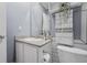 Bright bathroom with a granite vanity and modern fixtures, offering a clean and inviting space at 226 N Cleveland St # 226C, Indianapolis, IN 46204