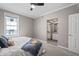 Bedroom filled with natural light with connecting door to the bathroom at 226 N Cleveland St # 226C, Indianapolis, IN 46204