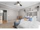 Spacious bedroom with ceiling fan, natural light, and neutral tones for a relaxing atmosphere at 226 N Cleveland St # 226C, Indianapolis, IN 46204