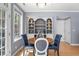 Dining area with built-in shelving, hardwood floors, and large window for natural light at 226 N Cleveland St # 226C, Indianapolis, IN 46204