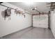Spacious garage with epoxy floor, overhead door with opener, and storage racks to maximize space at 226 N Cleveland St # 226C, Indianapolis, IN 46204