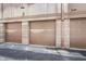 Exterior view of multiple garage doors, offering convenient parking options for residents at 226 N Cleveland St # 226C, Indianapolis, IN 46204