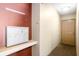 Well-lit hallway features a bank of mailboxes and leads to an exterior door, offering secure access at 226 N Cleveland St # 226C, Indianapolis, IN 46204