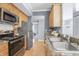 Kitchen features stainless steel appliances, granite countertops, and wood cabinets at 226 N Cleveland St # 226C, Indianapolis, IN 46204