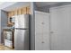 Kitchen featuring stainless steel refrigerator and appliances, with a pantry for additional storage at 226 N Cleveland St # 226C, Indianapolis, IN 46204