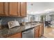Kitchen with granite countertops, stainless steel appliances, and hardwood floors at 226 N Cleveland St # 226C, Indianapolis, IN 46204