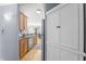Bright kitchen boasts stainless steel appliances, granite countertops, and a seamless flow into the dining area at 226 N Cleveland St # 226C, Indianapolis, IN 46204