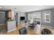 Open concept living room with balcony access and views of the surrounding neighborhood at 226 N Cleveland St # 226C, Indianapolis, IN 46204