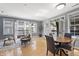 Open-concept living area with hardwood floors and french doors leading to balconies at 226 N Cleveland St # 226C, Indianapolis, IN 46204