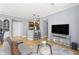 Cozy living room with hardwood floors, open to the kitchen with a breakfast bar at 226 N Cleveland St # 226C, Indianapolis, IN 46204