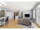 Open-concept living and dining space with hardwood floors and abundant natural light at 226 N Cleveland St # 226C, Indianapolis, IN 46204