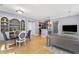 Bright living room features hardwood floors and opens to the kitchen and dining areas at 226 N Cleveland St # 226C, Indianapolis, IN 46204