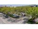 A parking lot is shown with various cars parked under trees at 226 N Cleveland St # 226C, Indianapolis, IN 46204