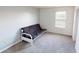 Simple bedroom with a futon couch and a window letting in natural light at 2441 Longleaf Dr, Greenwood, IN 46143