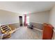 Comfortable bedroom featuring neutral colors, a window, and a sitting chair at 2441 Longleaf Dr, Greenwood, IN 46143